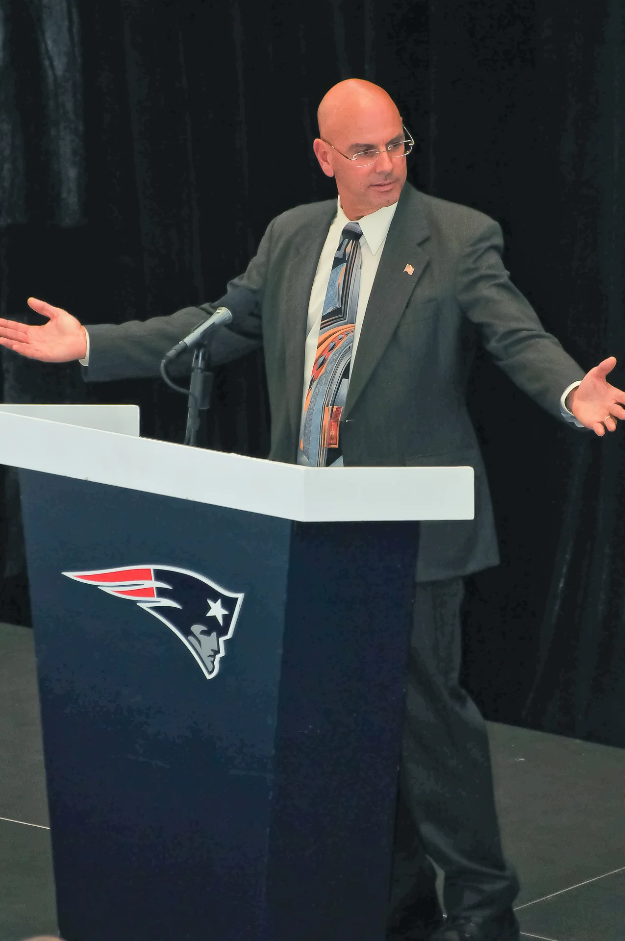 Brian Hagopian presenting from a lectern during a professional seminar