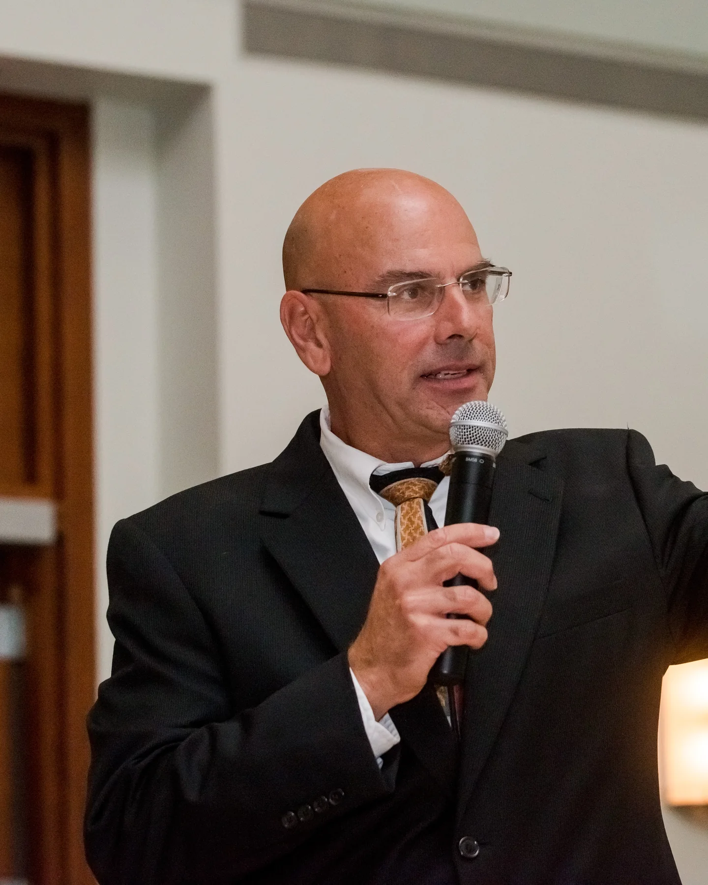 Brian Hagopian speaking to an audience at an industry event