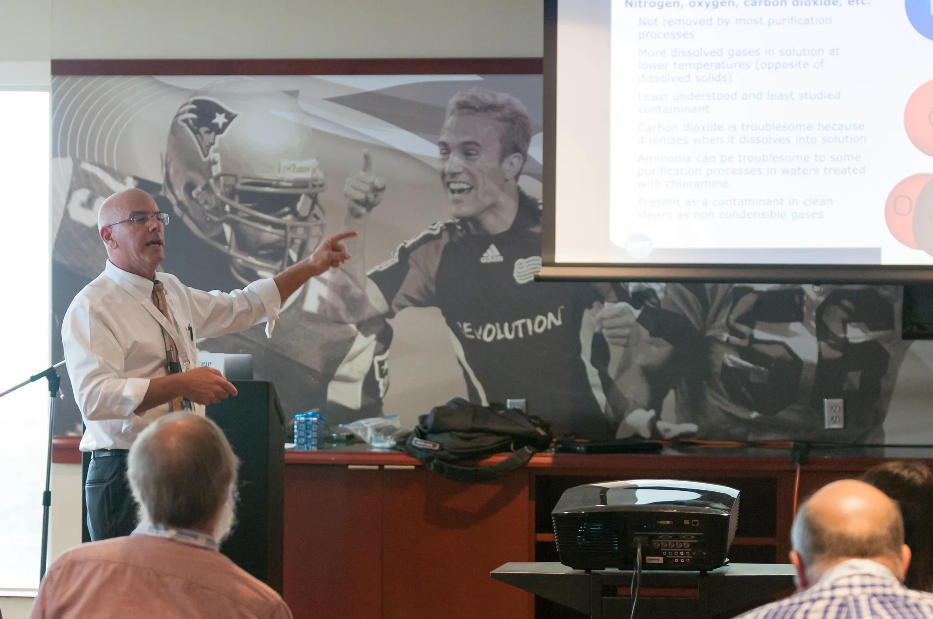 Brian Hagopian teaching professionals about contaminants in purified water